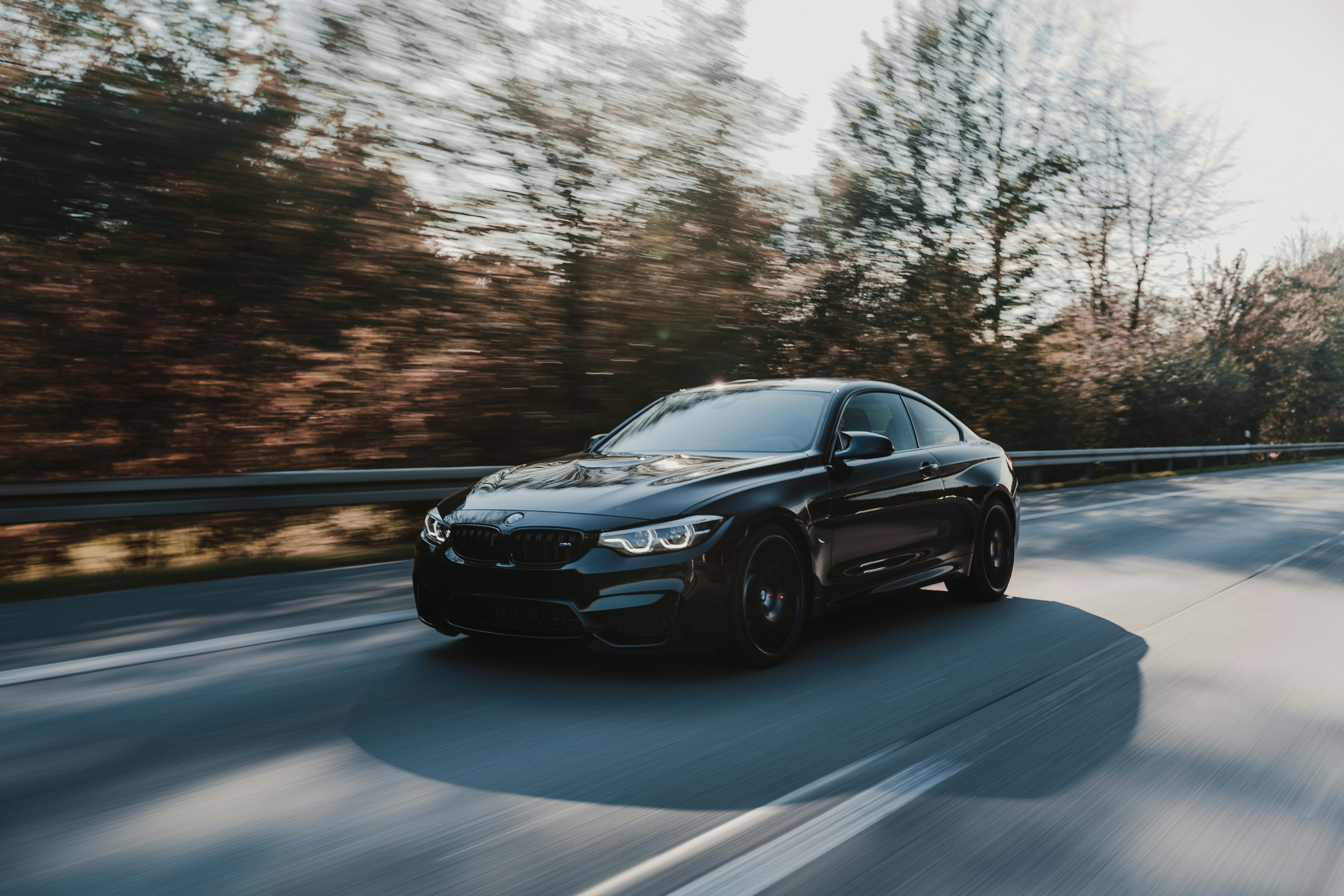 black coupe on road